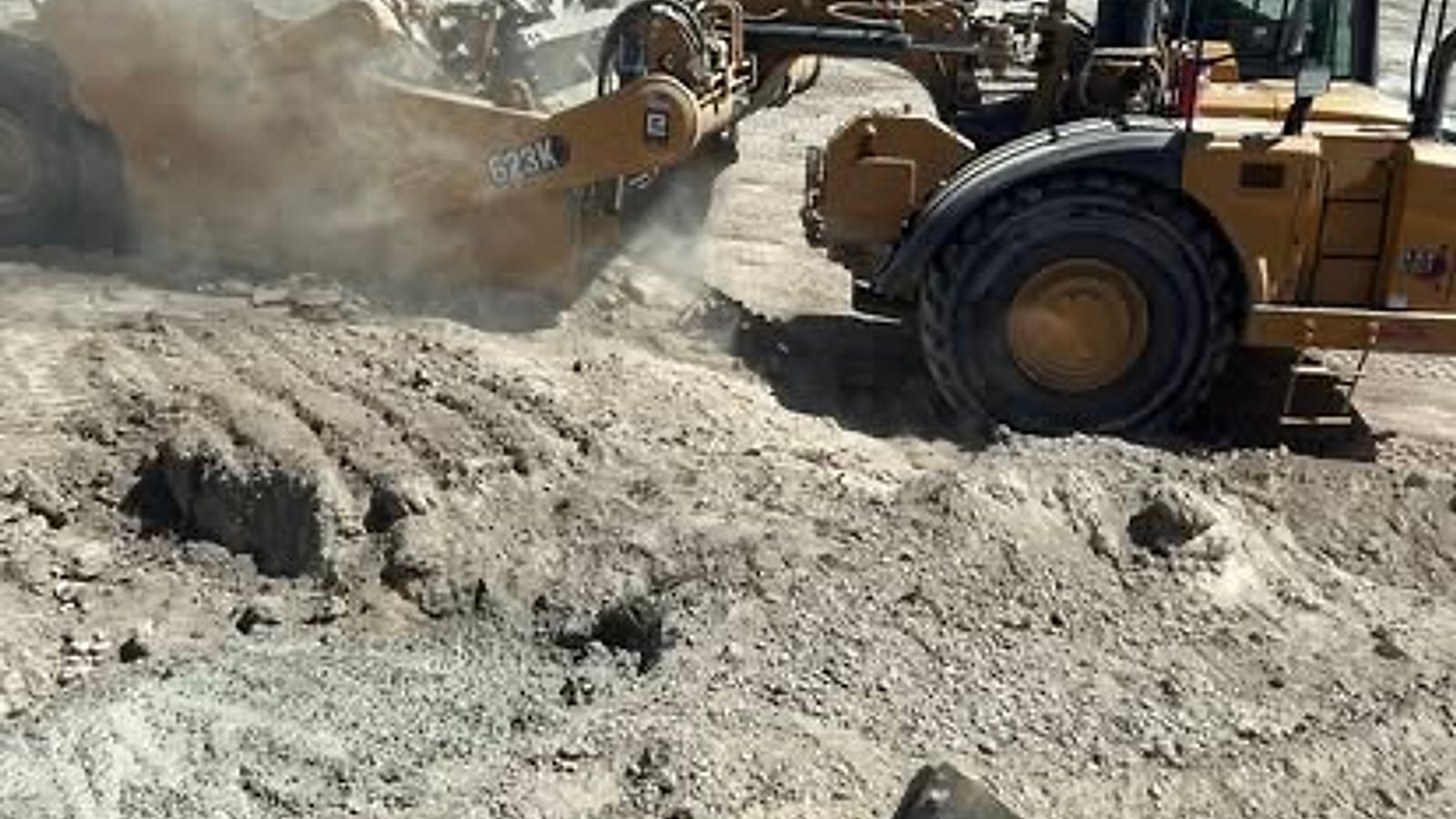 Caterpillar scrapers moving material on a large Arizona earthwork project