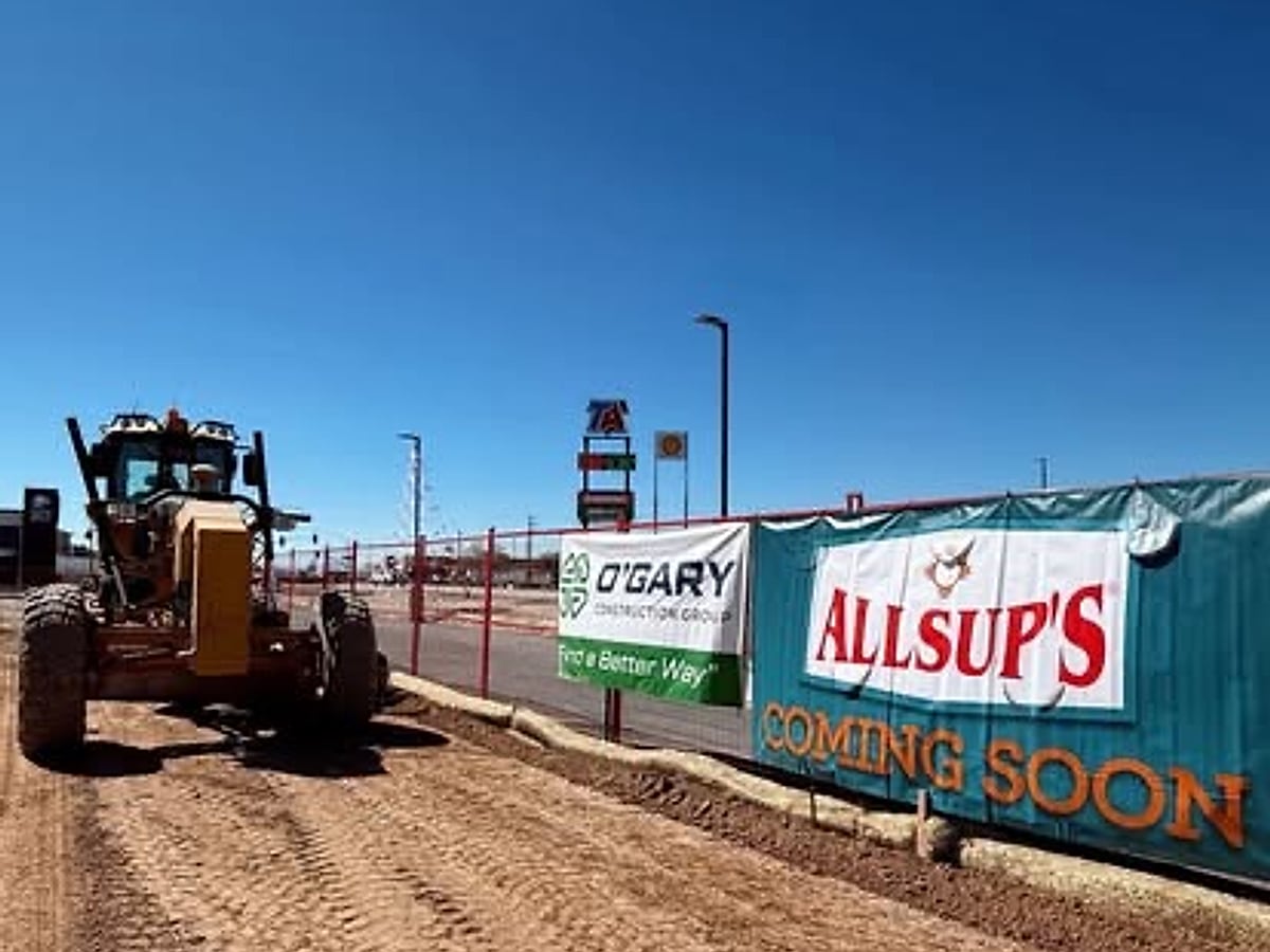 Graded commercial site development along a building with a long fill slope