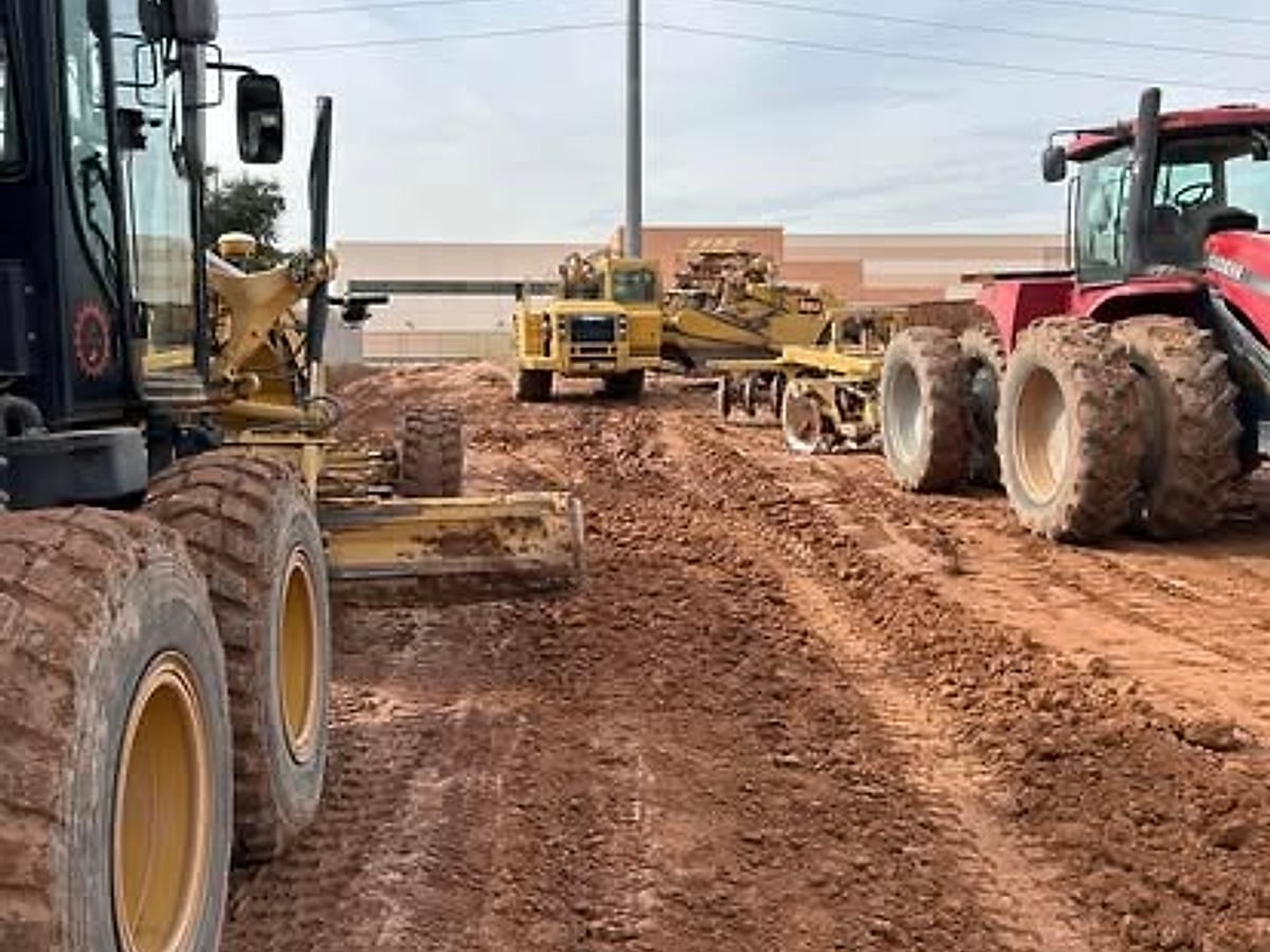 Wide graded roadway subgrade prepared across an Arizona site