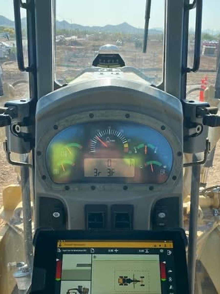 In-cab Trimble grade-control screen showing the 3D terrain surface model